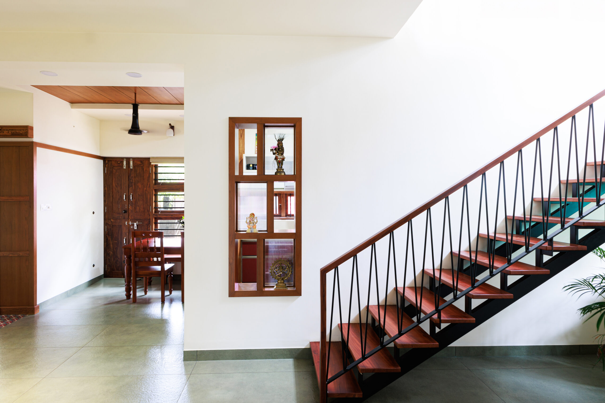 Modern home interior with wooden staircase and decor -1