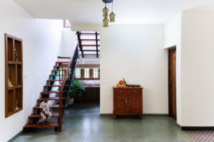 Modern home interior with wooden staircase and decor