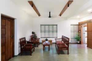 Living room with wooden furniture and modern window blinds