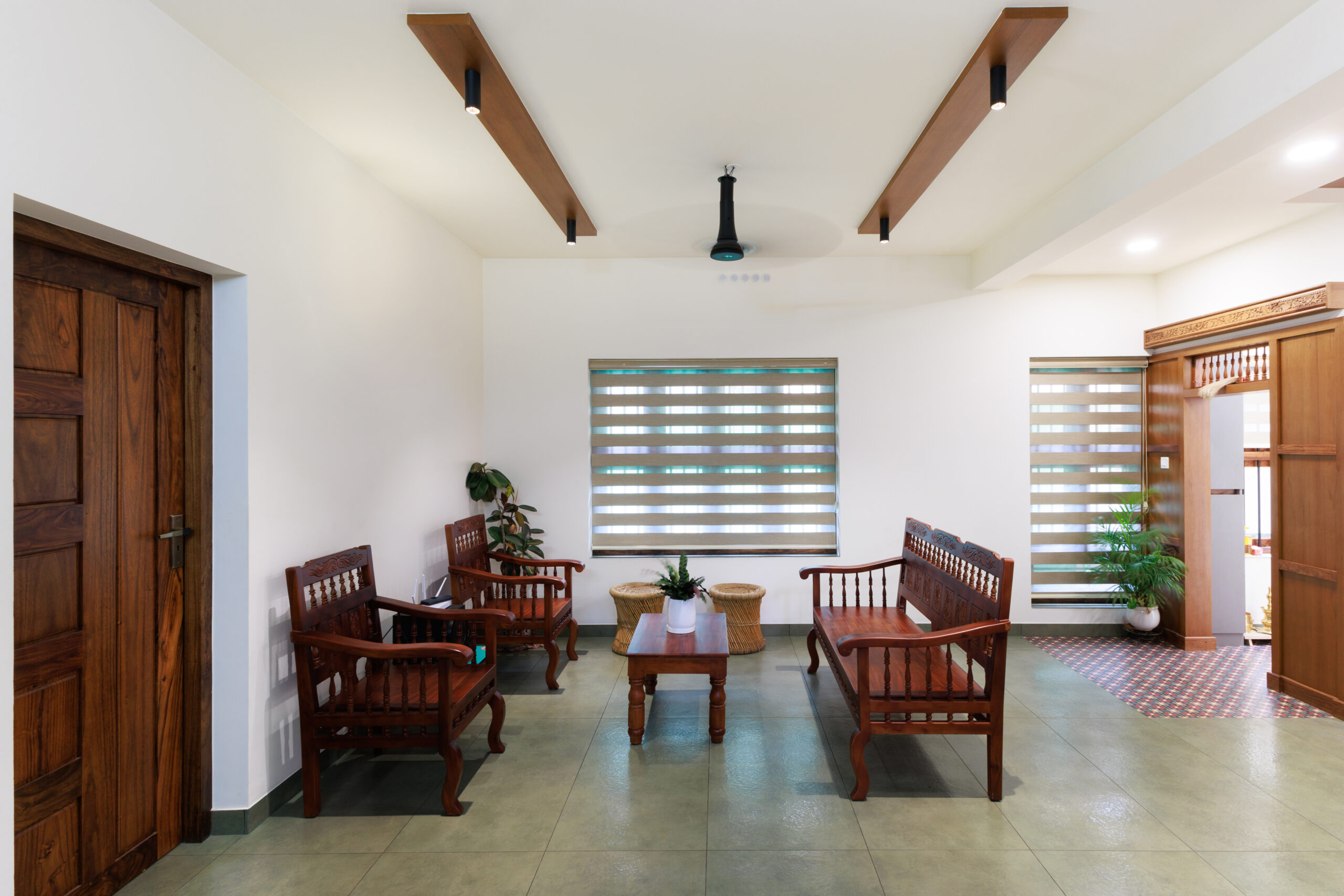 Living room with wooden furniture and modern window blinds